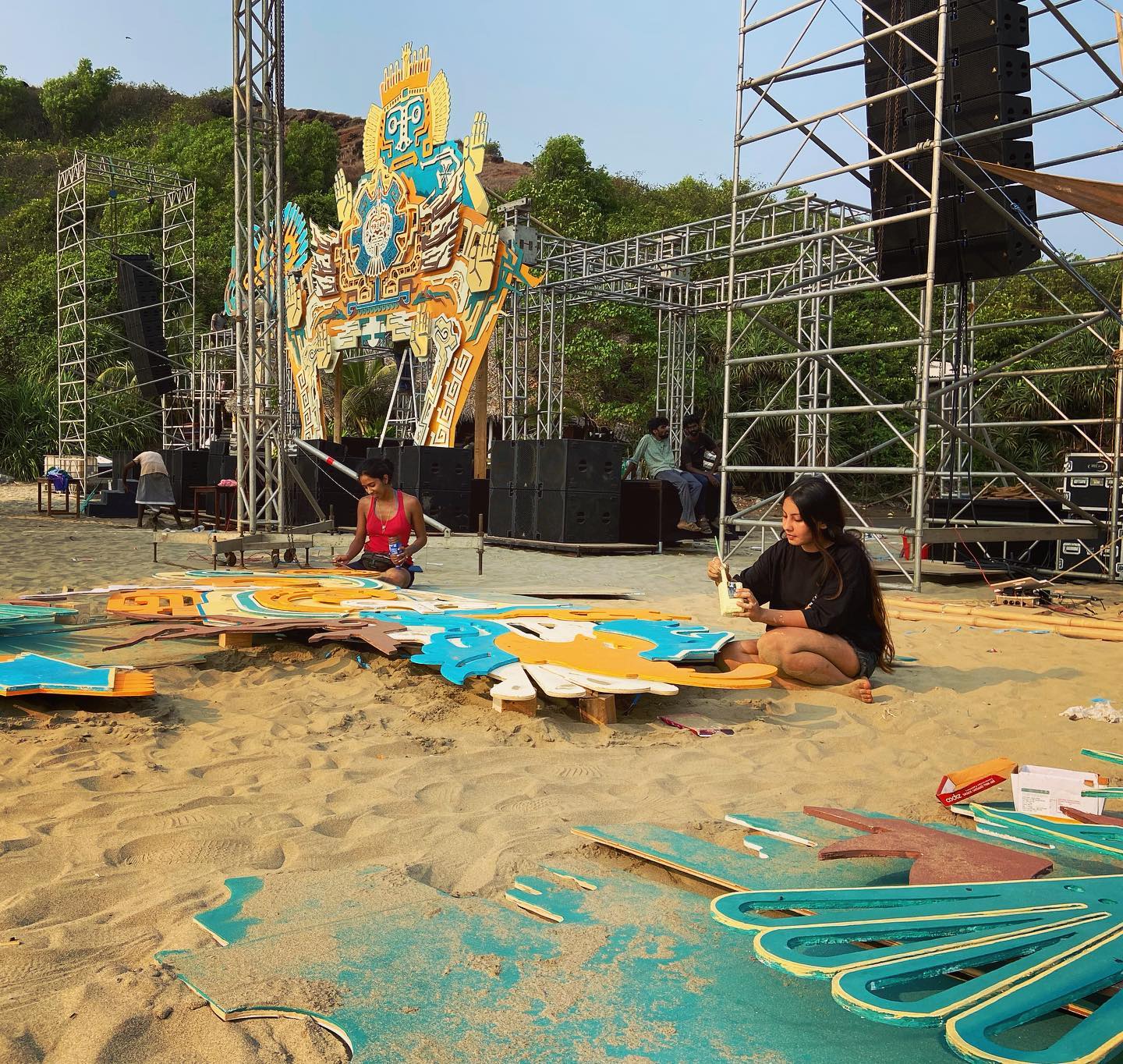 Building a festival stage installation on a Goa beach