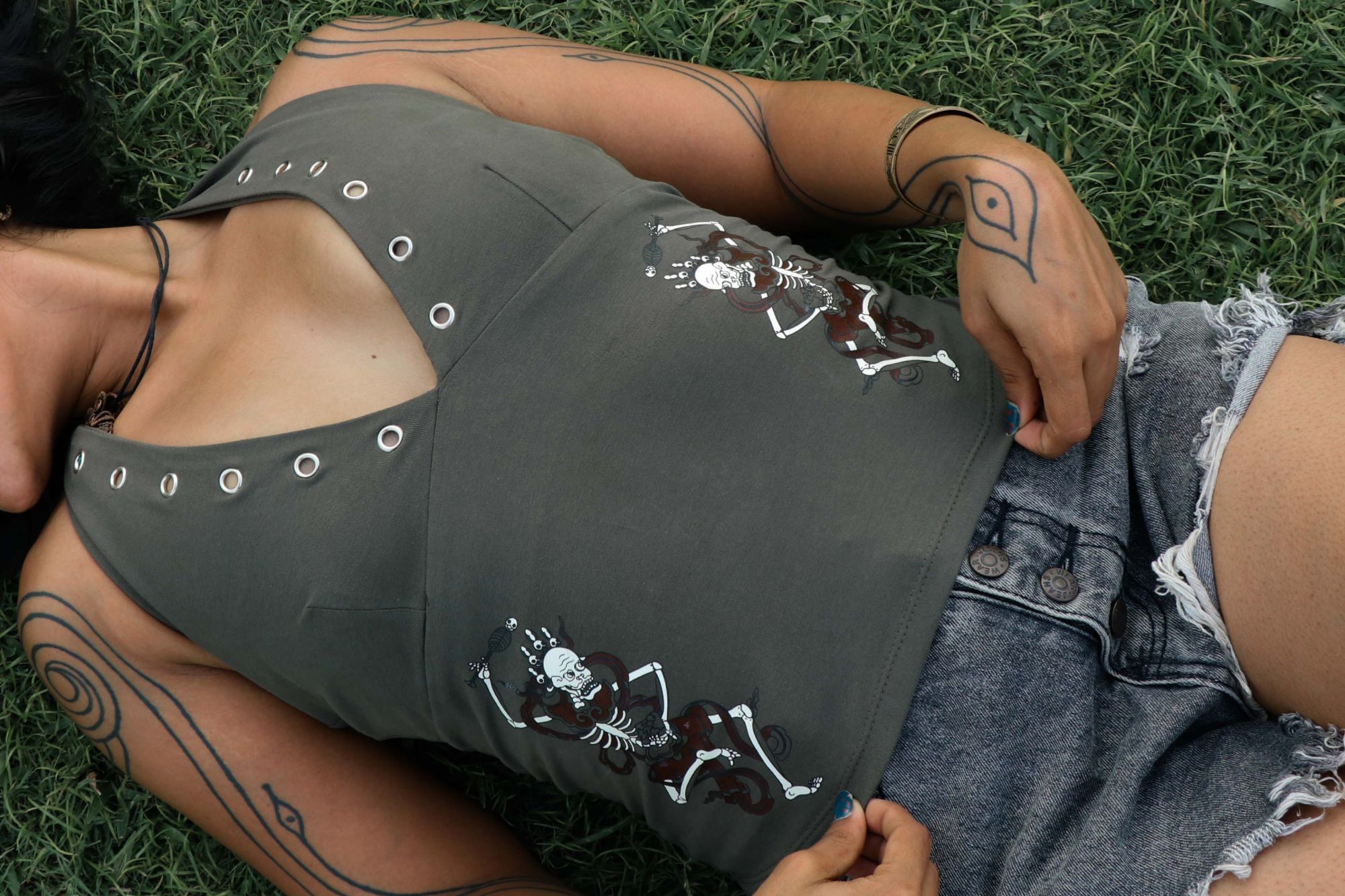 Ritual Halter Top in olive worn, Citipati prints at the waist